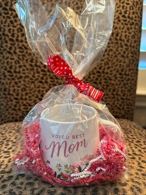 Voted Best Mom White Ceramic Mug with Pink Lettering. Gift wrapping included.
